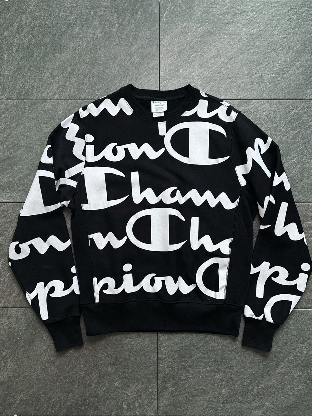 Champion Black Crewneck with Bold White All-Over Logo Men’s M